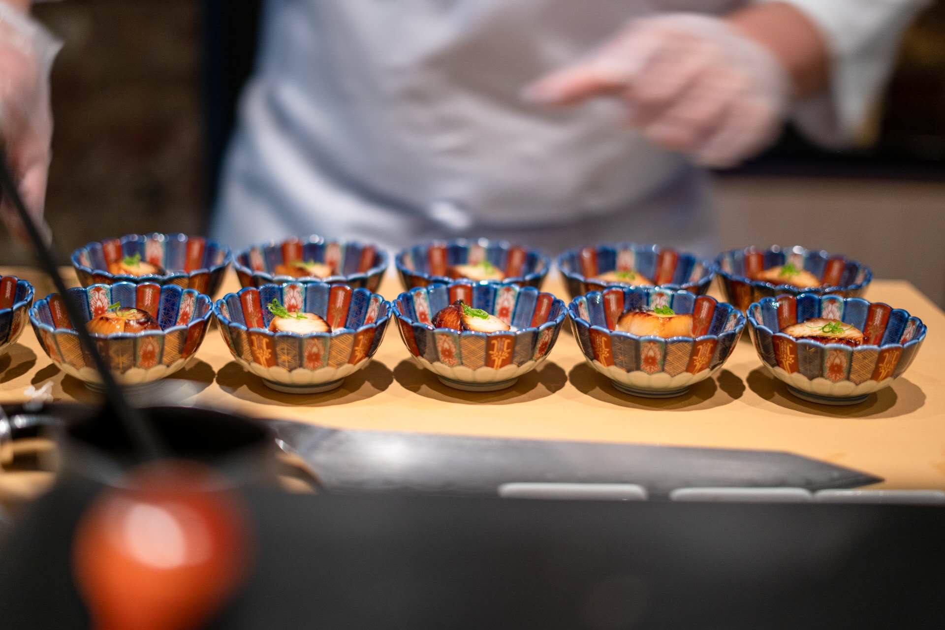 Chef preparing appetizer bowls